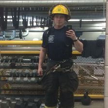 Firefighter receives free newborn care from Mission Sleep.